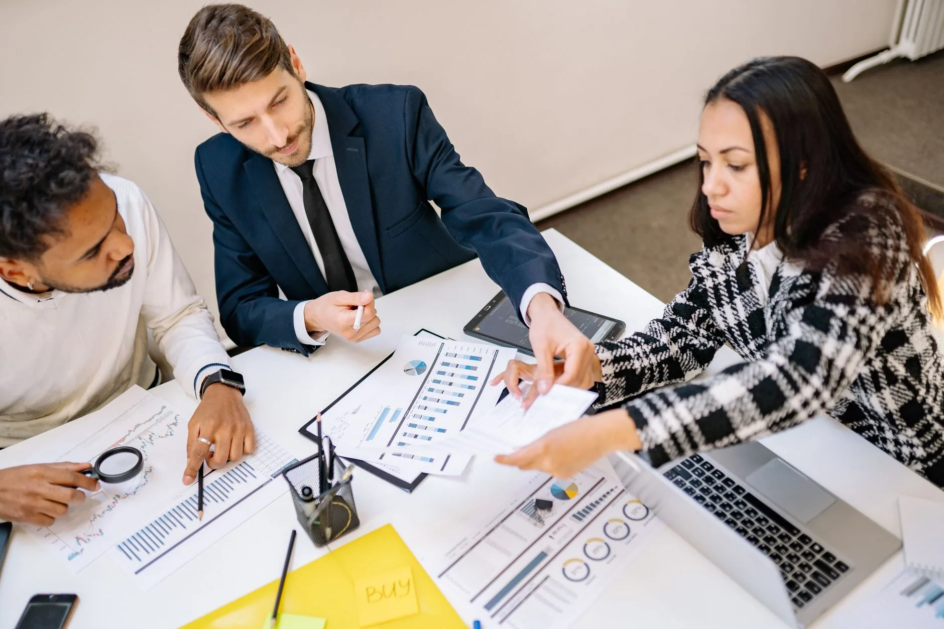 Business team reviewing IT proposals in a meeting